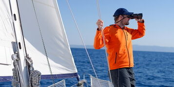 Man,Sailing,With,Sails,Out,On,A,Sunny,Day